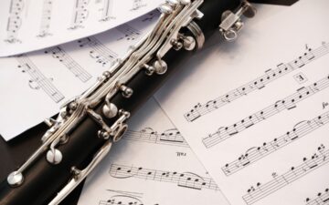 clarinet laying on sheet music