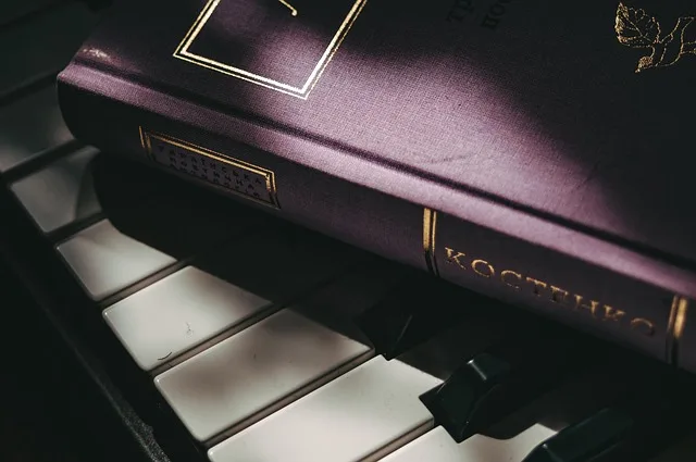 purple book on piano keyboard