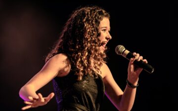 person singing in a mircophone