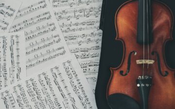 sheet music with a brown violin on the side